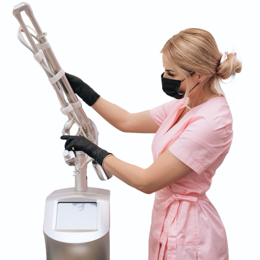 Beautician woman in medical clothes,mask,gloves prepares beauty device laser CO2 fractional. Laser used for skin rejuvenation. Medical cosmetic procedure in beauty laser clinic concept